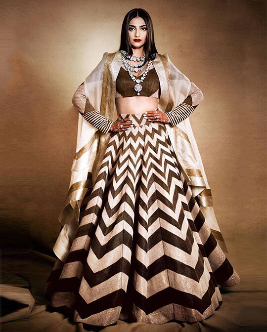 Sonam Kapoor wears a cream-coloured Bardot gown by Anamika Khanna and  Emilia Wickstead for King Char